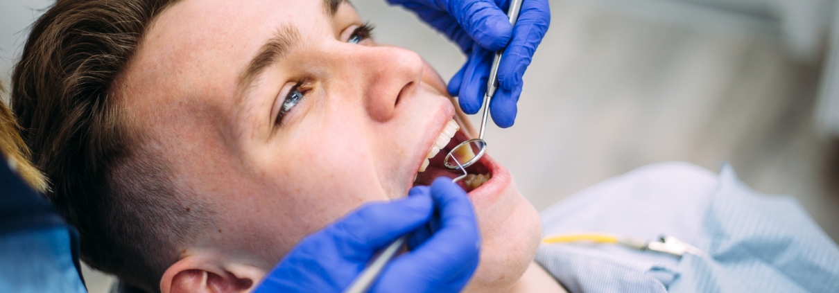 Boy at the dentist consultation. Checking and dental treatment in a clinic.